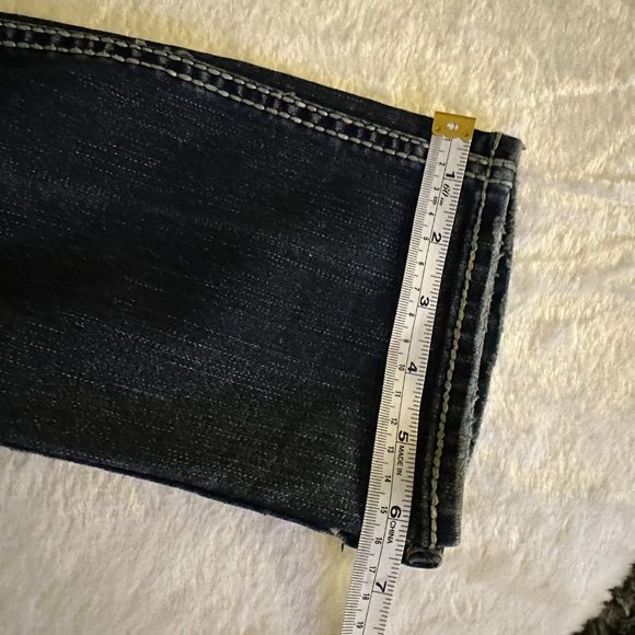 Silver denim slim bootcut jeans.  Embroidered, buttoned back pockets.  Size 24 - Picture 10 of 11